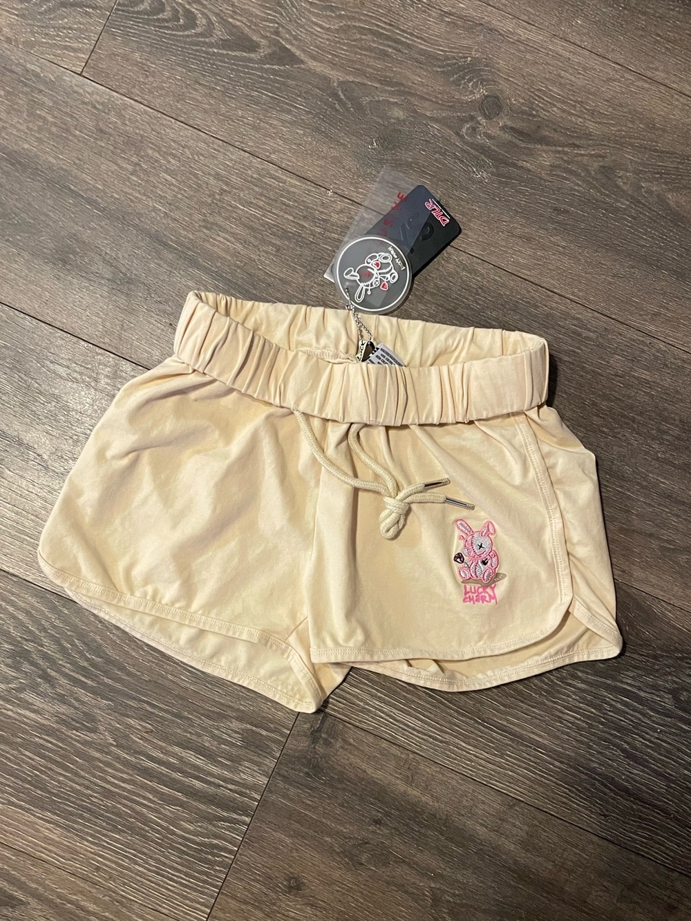 BKYS Lucky Charm dolphin shorts featuring a drawstring waist and a bunny graphic